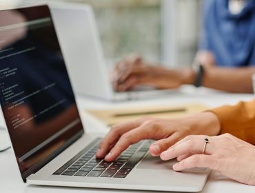 female-programmer-typing-codes-on-laptop-e1725336383441.jpg